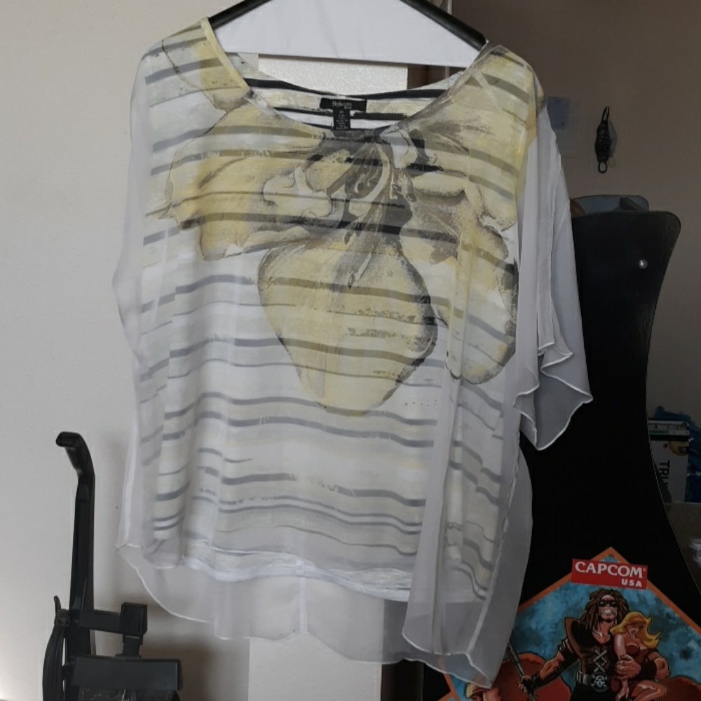 Striped top with yellow flower